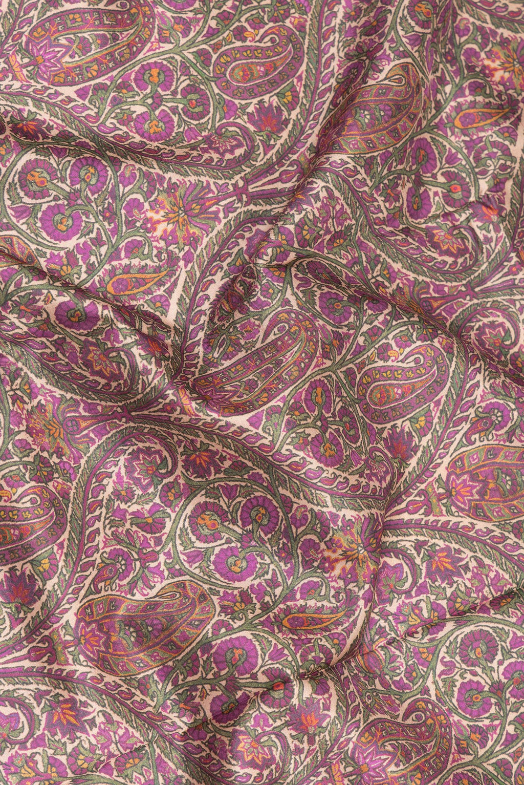 Close up of Pure Silk Purple Dual Tone Kanchipuram Saree with Printed design on the body and Zari Border.  displaying folds