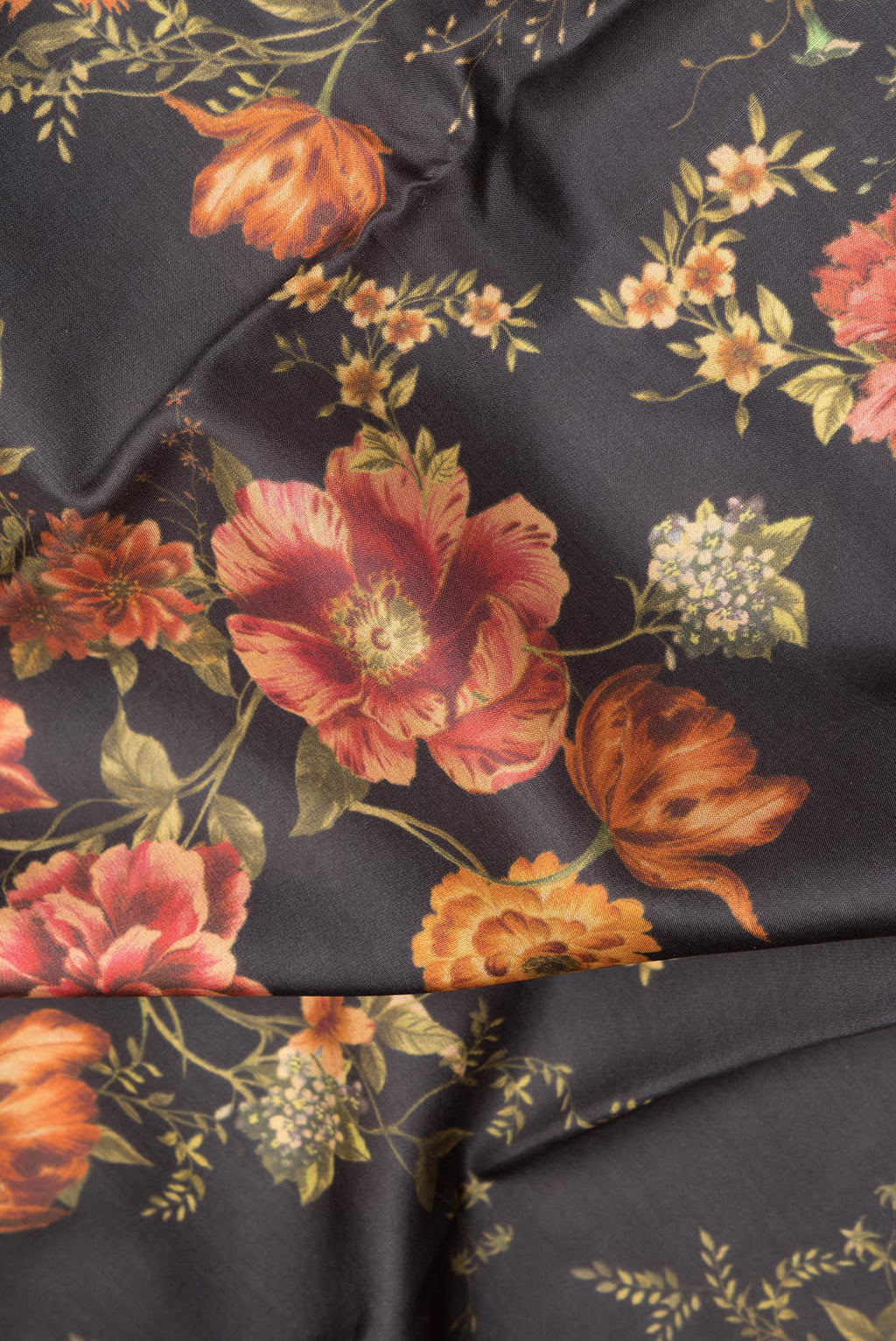 Close up of Pure Silk Black Dual Tone Kanchipuram Saree with Printed design on the body and Zari Border.  displaying folds