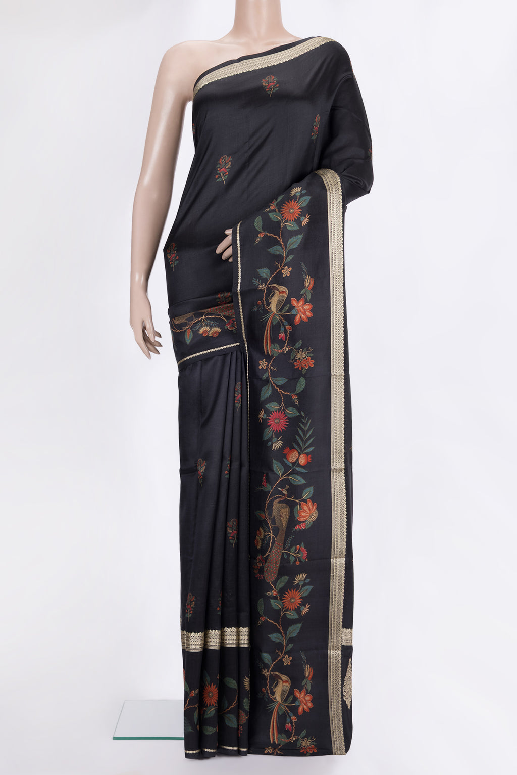 Pure Silk Black Printed Saree with Printed design on the body and Fancy Border.  displayed on a mannequin
