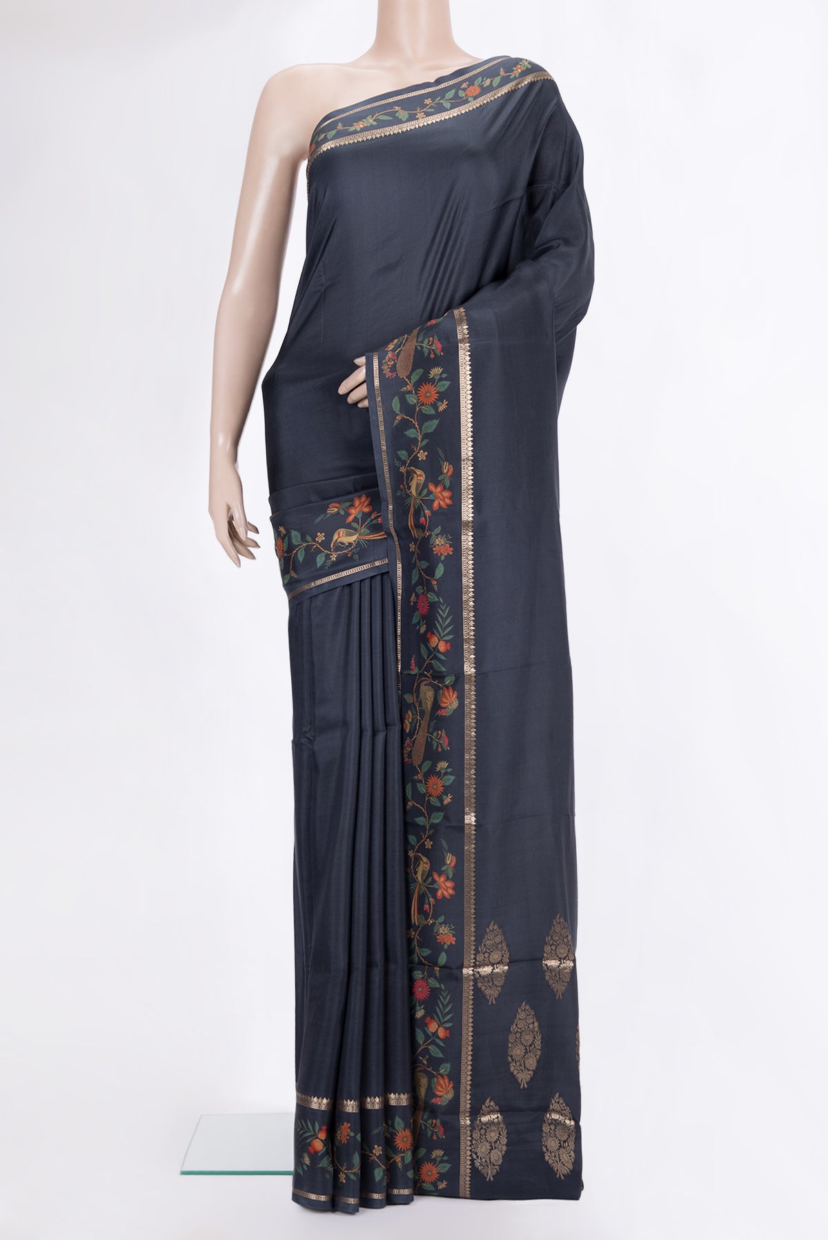 Black Mysore Crepe Saree with Plain Body and Printed Border.  displayed on a mannequin