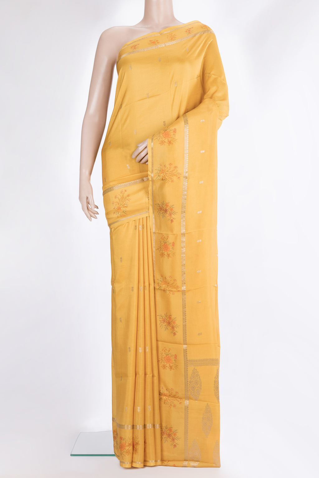 Mustard Dual Tone Crepe Saree with Zari Butta on the body and Fancy Border.  displayed on a mannequin