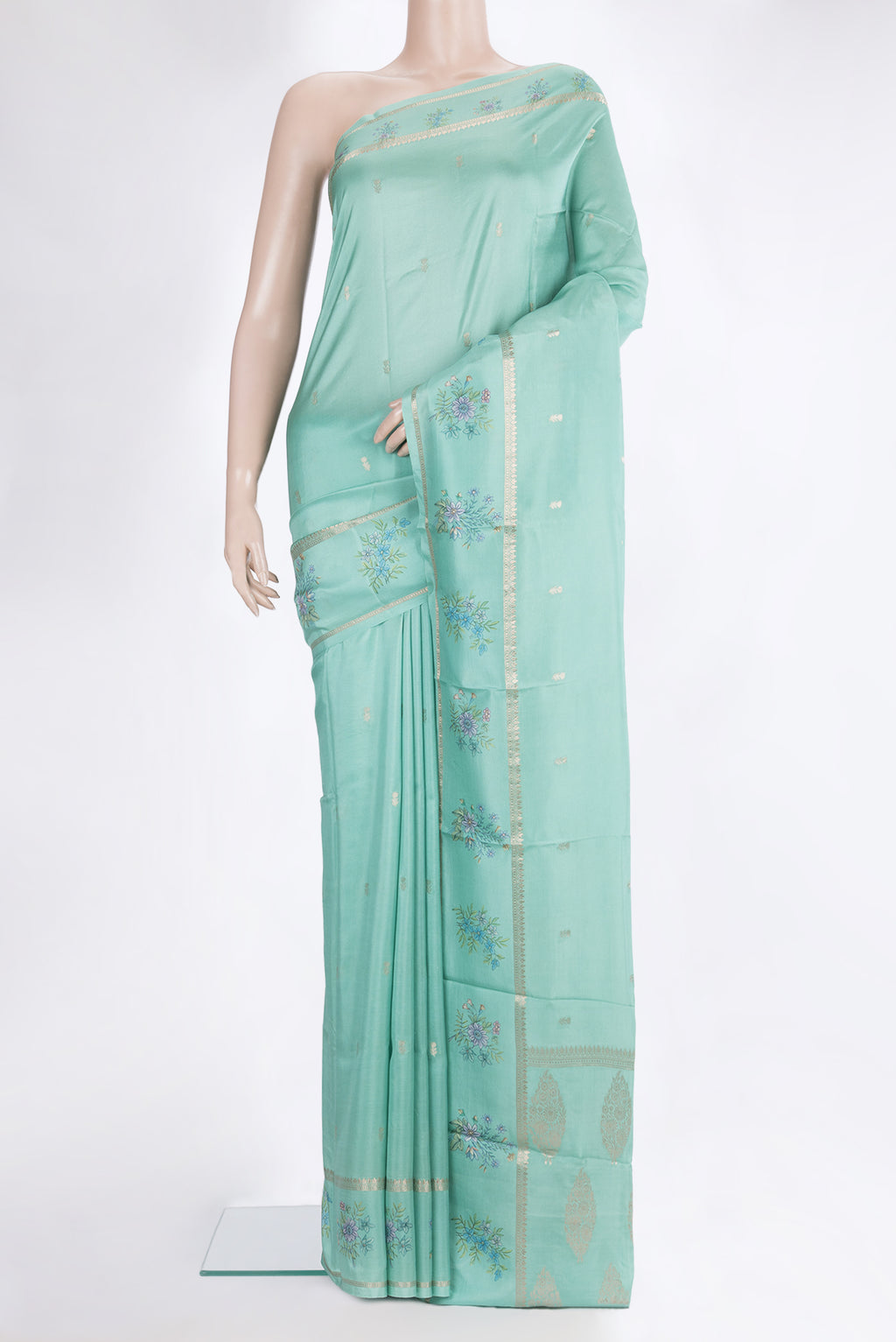 Light Green Dual Tone Crepe Saree with Zari Butta on the body and Fancy Border.  displayed on a mannequin