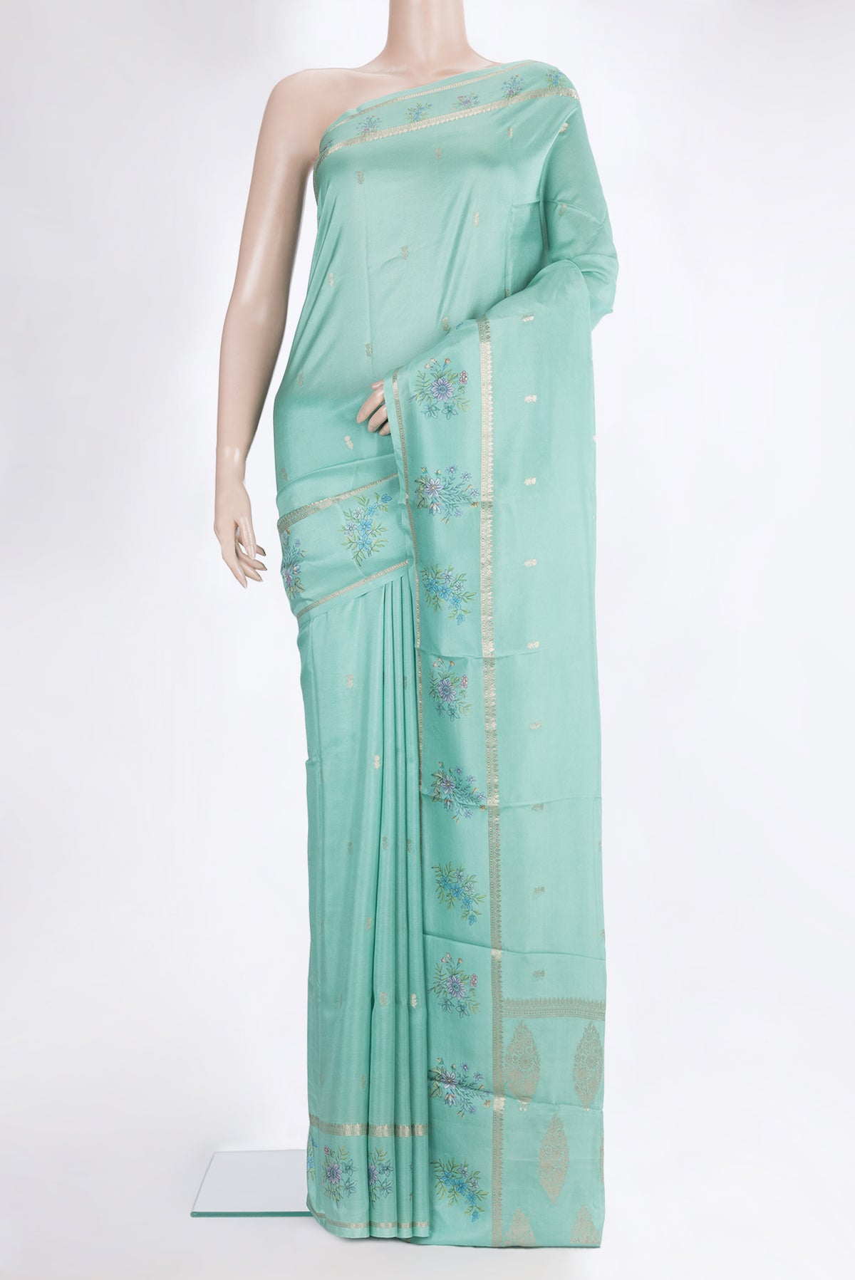 Light Green Dual Tone Crepe Saree with Zari Butta on the body and Fancy Border.  displayed on a mannequin