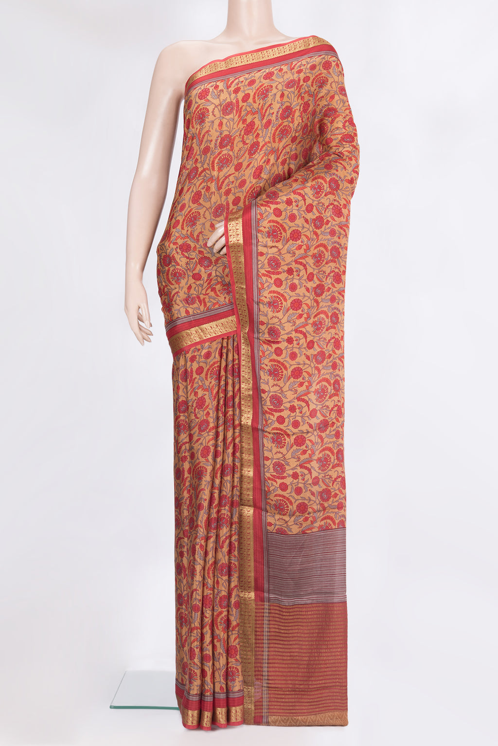 Brown Crepe Saree with Printed design on the body and Zari Border.  displayed on a mannequin