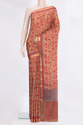 Brown Crepe Saree with Printed design on the body and Zari Border.  displayed on a mannequin