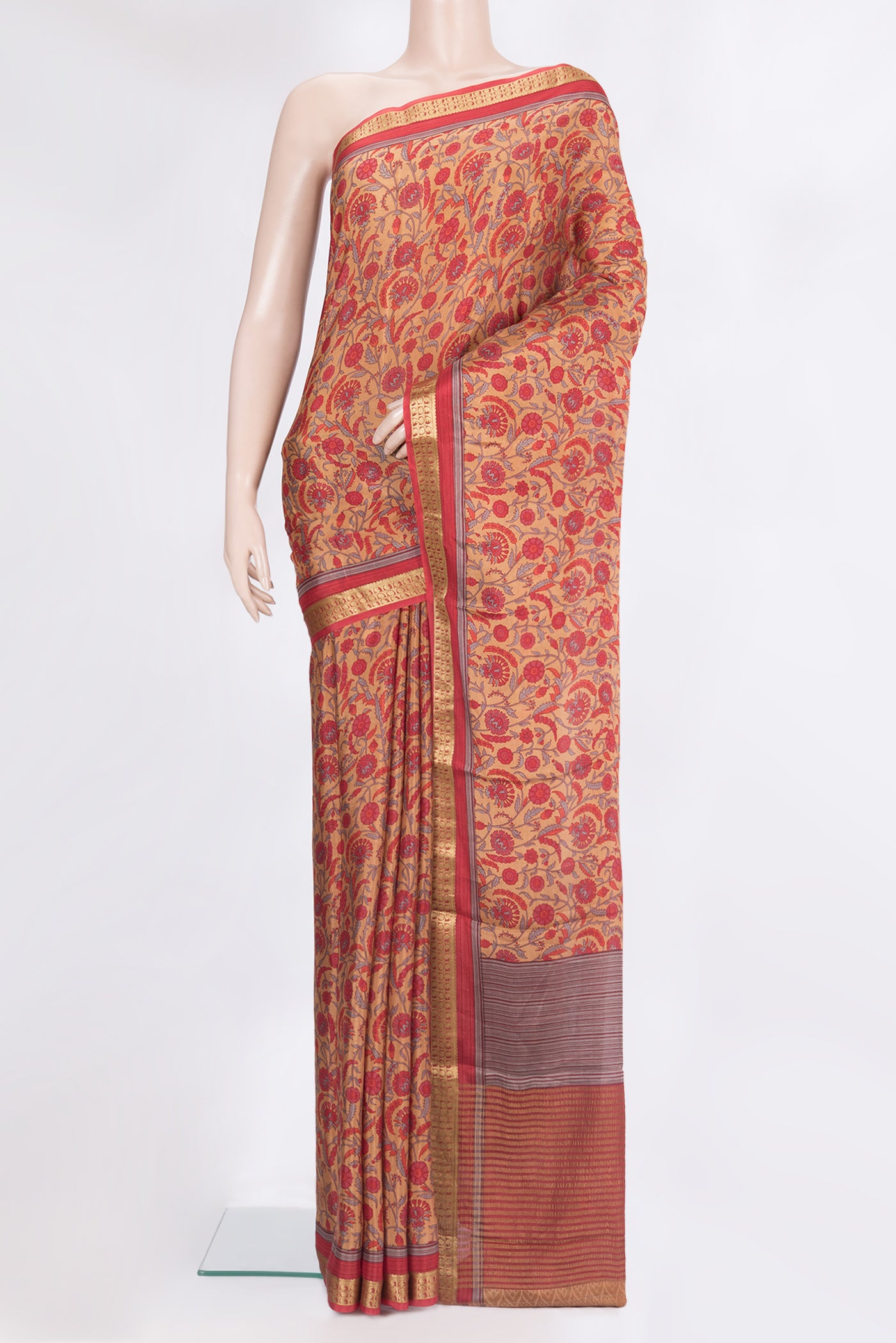 Brown Crepe Saree with Printed design on the body and Zari Border.  displayed on a mannequin