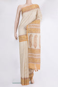 Beige Tussar Saree with Zari Butta on the body and Embroidered Border.  displayed on a mannequin