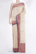 Cream Tussar Saree with Embroidered on the body and Zari Border.  displayed on a mannequin