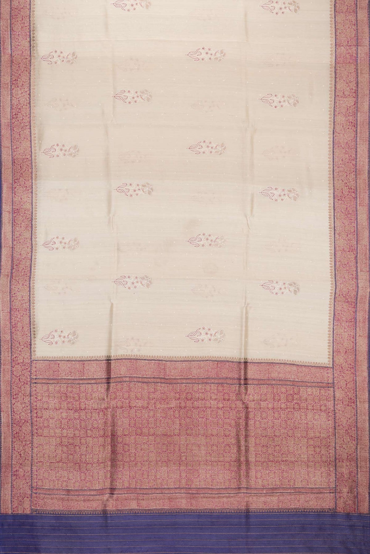 Flat view of Cream Tussar Saree with Embroidered on the body and Zari Border. 