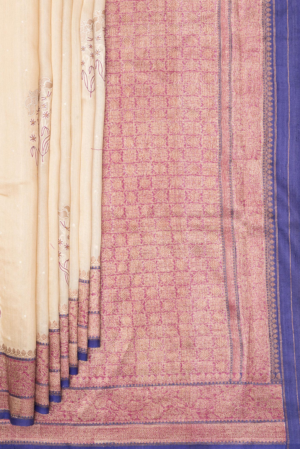 Pleats and pallu of Cream Tussar Saree with Embroidered on the body and Zari Border. 