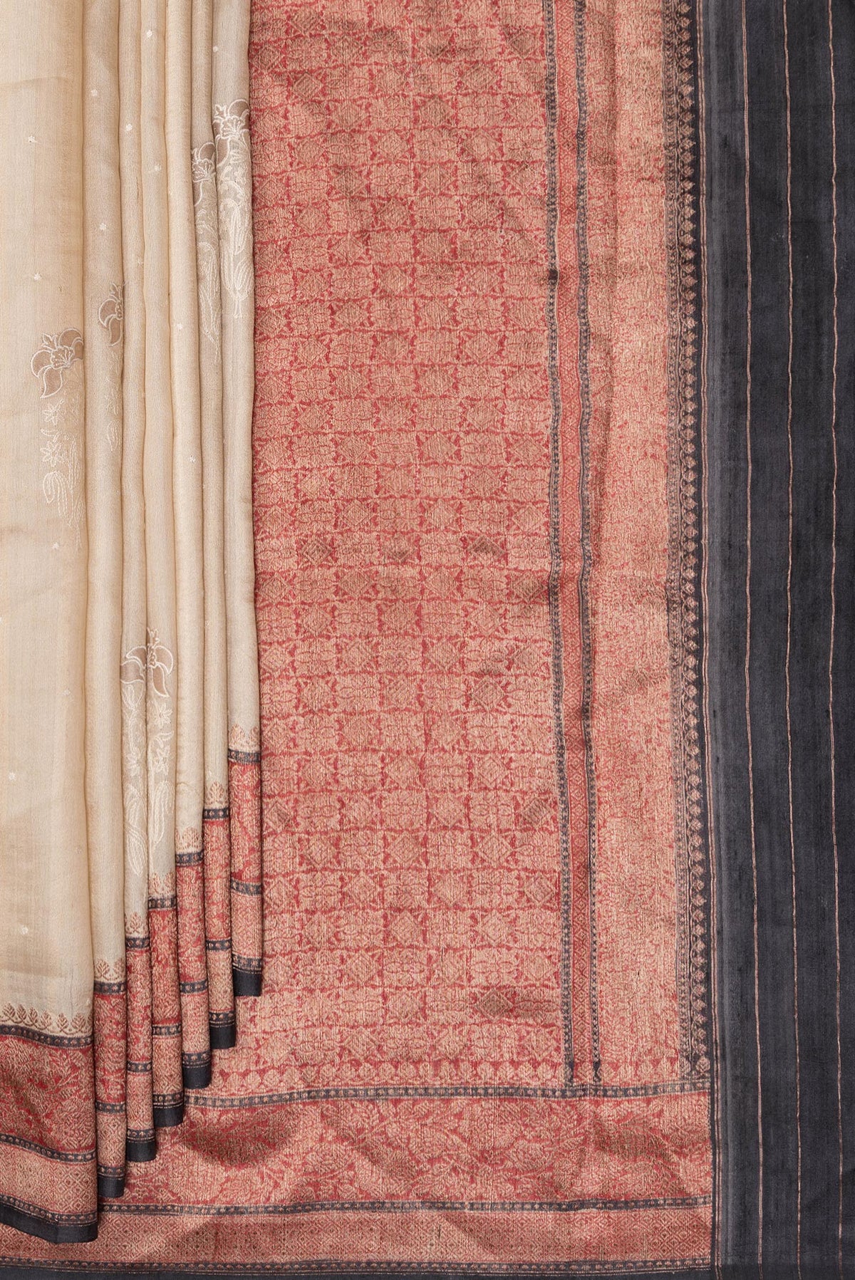 Pleats and pallu of Pure Silk Sandal Tussar Saree with Embroidered on the body and Embroidered Border. 