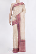 Beige Tussar Saree with Embroidered on the body and Zari Border.  displayed on a mannequin