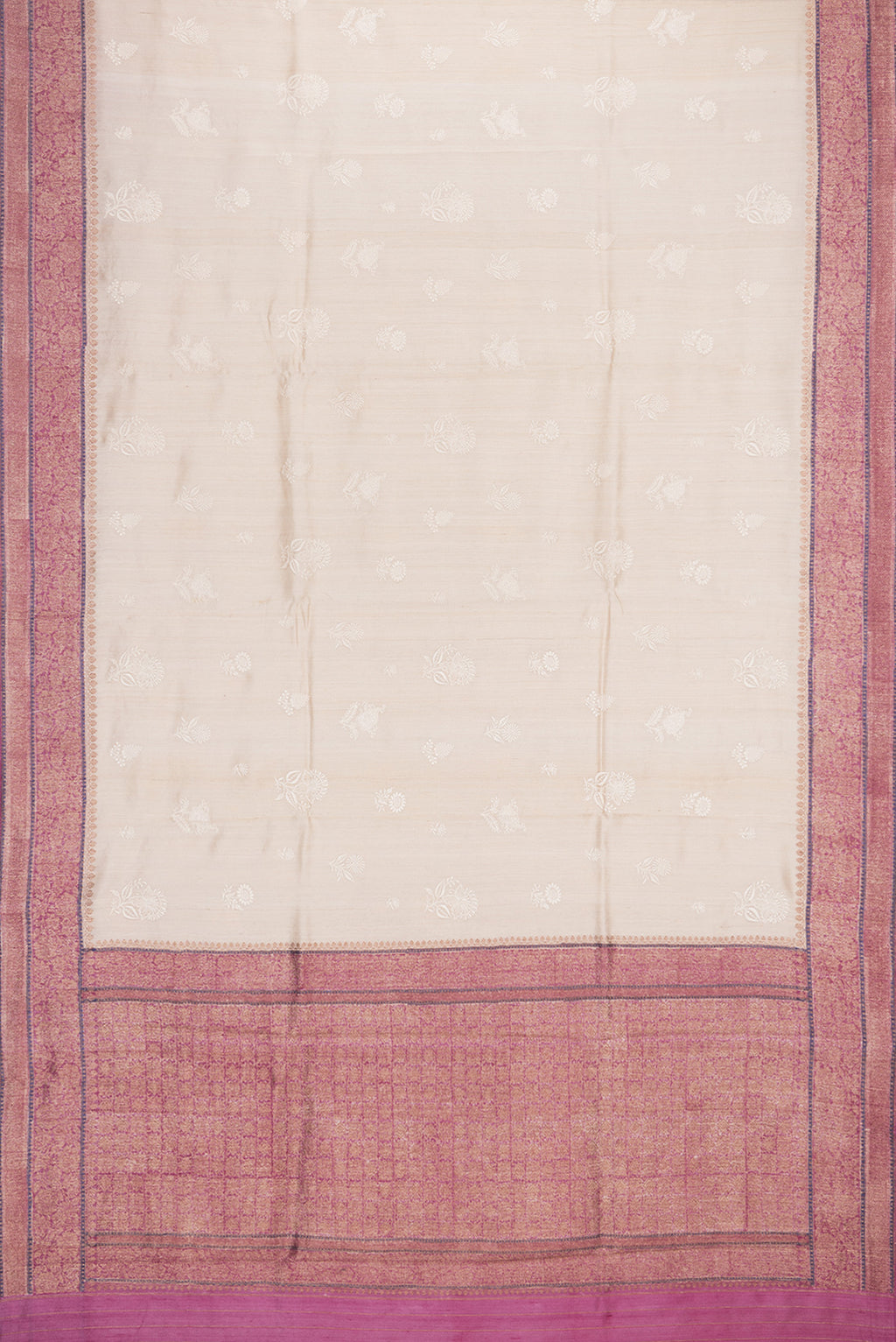 Flat view of Beige Tussar Saree with Embroidered on the body and Zari Border. 
