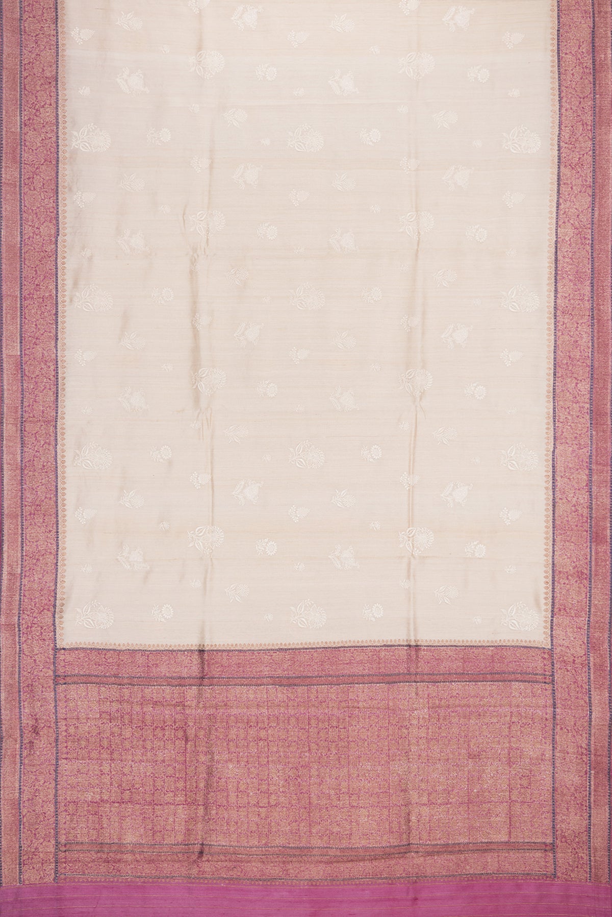 Flat view of Beige Tussar Saree with Embroidered on the body and Zari Border. 