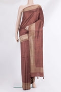 Brown Tussar Saree with Embroidered on the body and Zari Border.  displayed on a mannequin