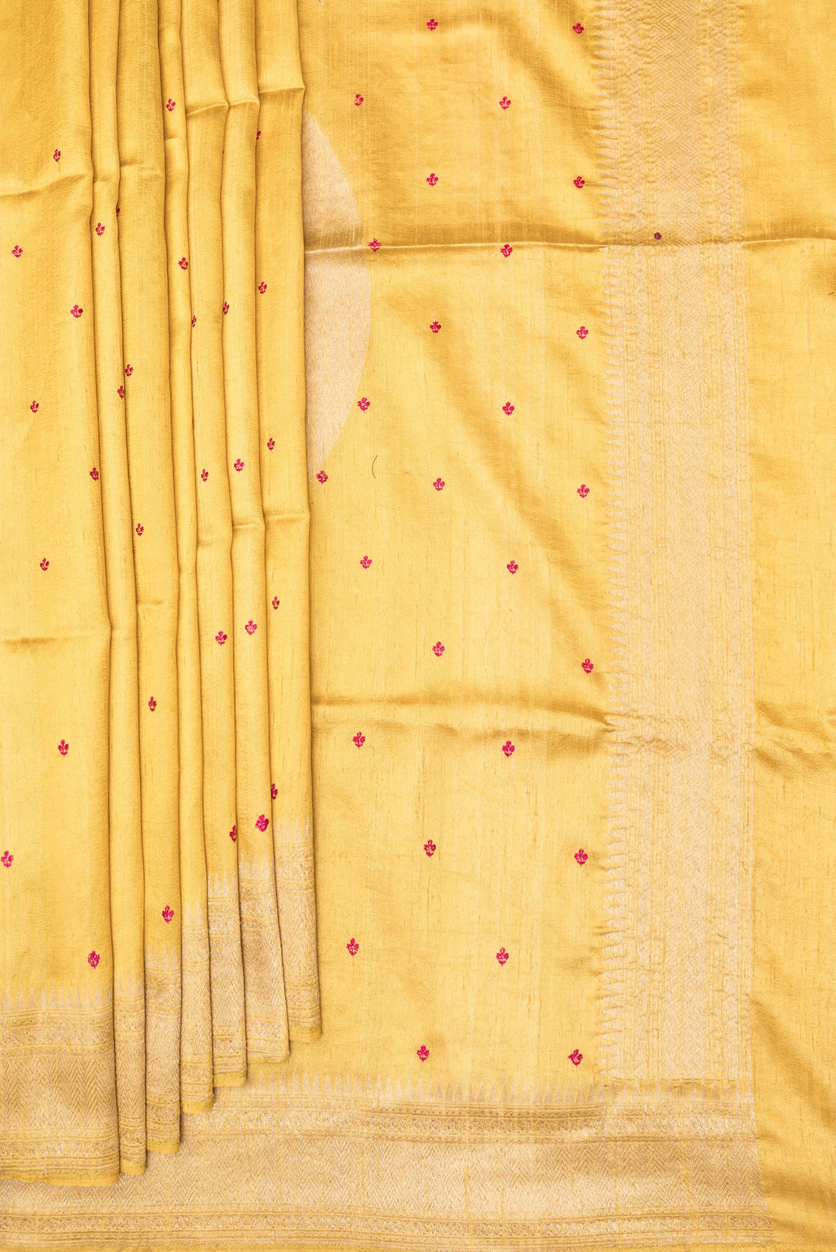 Pleats and pallu of Pure Silk Sandal Dual Tone Raw Saree with Embroidery on the body and Zari Border. 