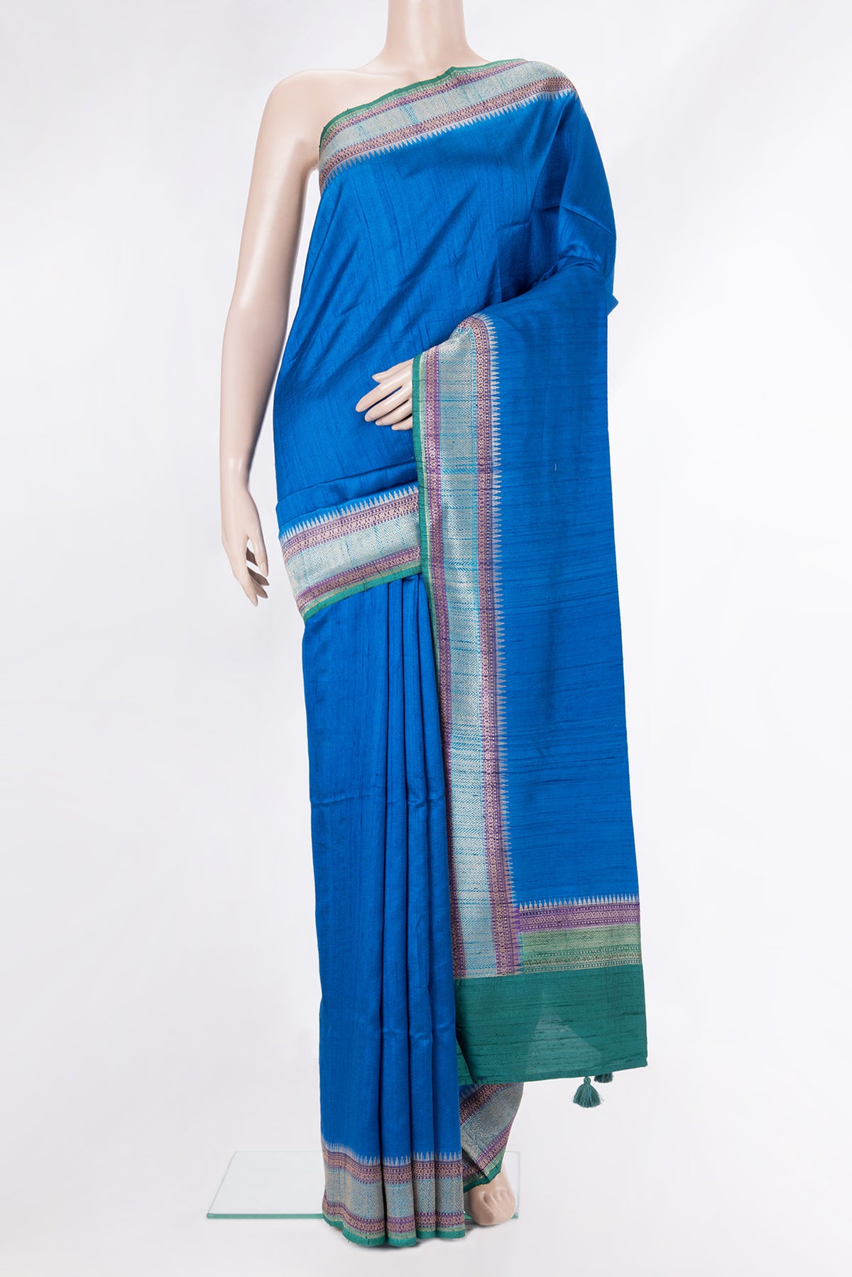 Pure Silk Royal Blue Tussar Saree with Plain Body and Zari Border.  displayed on a mannequin