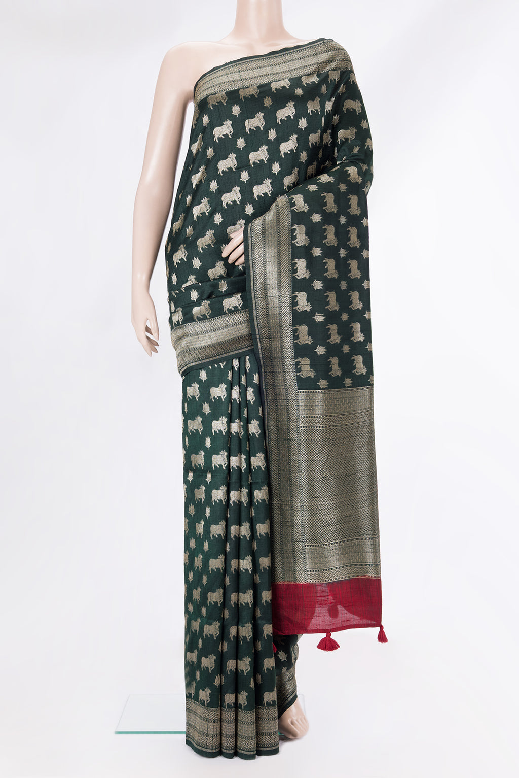 Pure Silk Bottle Green Tussar Saree with Zari Butta on the body and Zari Border.  displayed on a mannequin