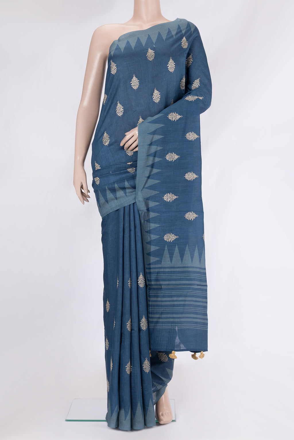 Maya Blue Tussar Silk Saree with Embroidery on the body and Fancy Border.  displayed on a mannequin
