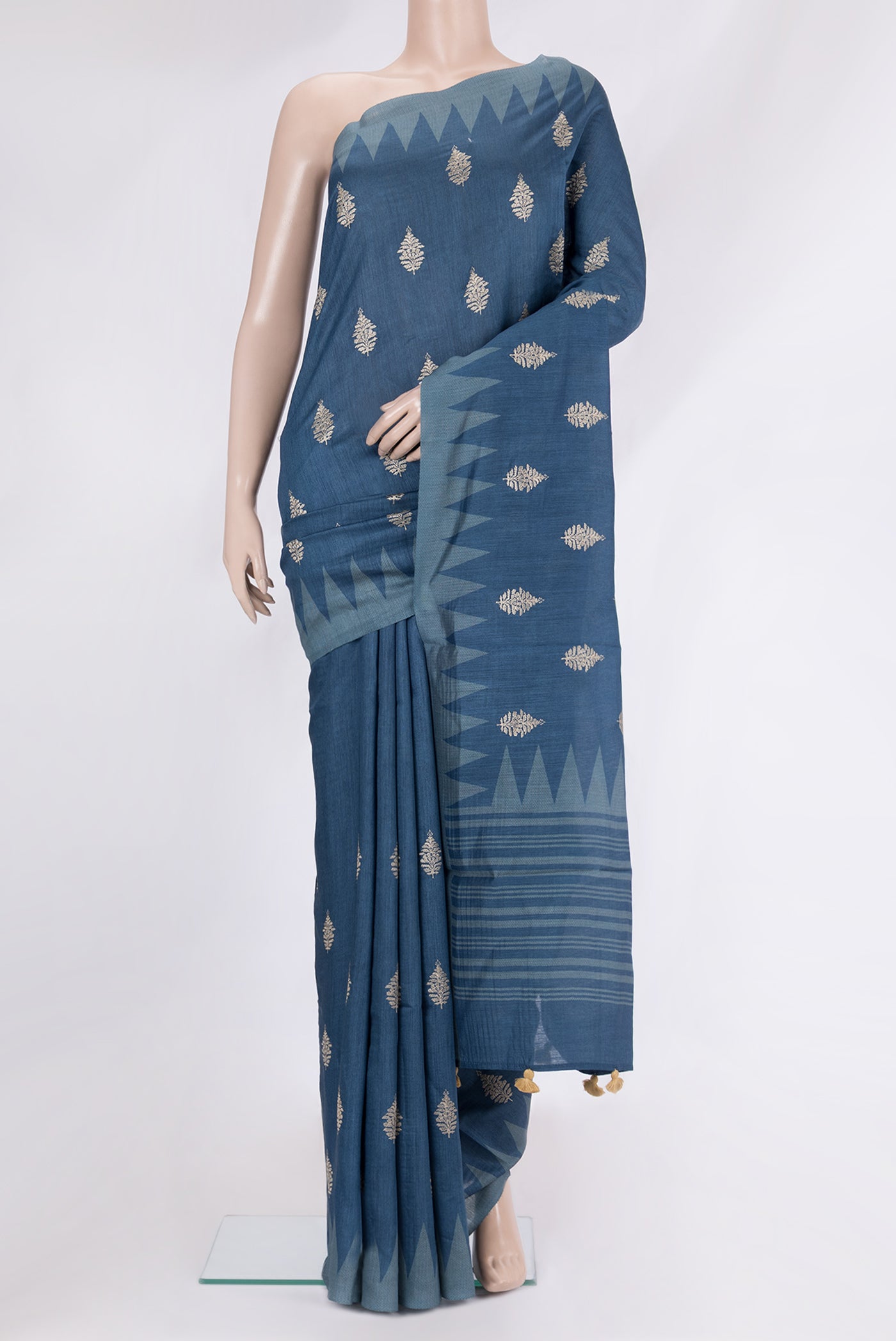 Maya Blue Tussar Silk Saree with Embroidery on the body and Fancy Border.  displayed on a mannequin