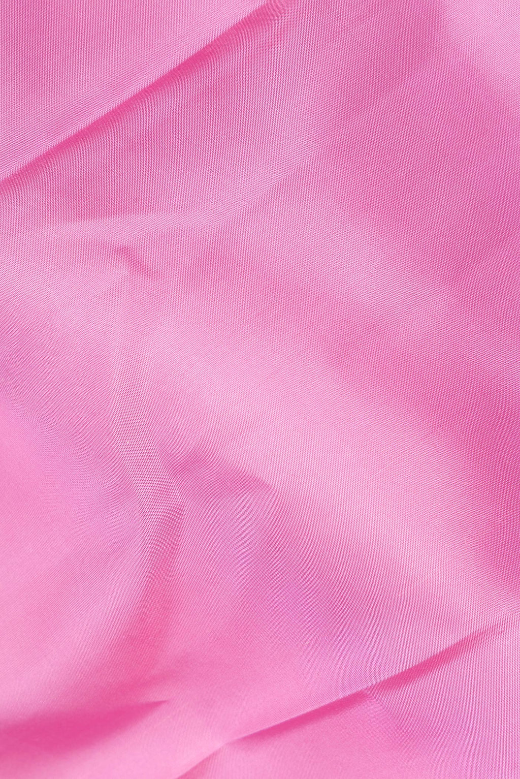 Close up of Pure Silk Rose pink Kanchipuram Saree with Plain Body and Temple Border.  displaying folds