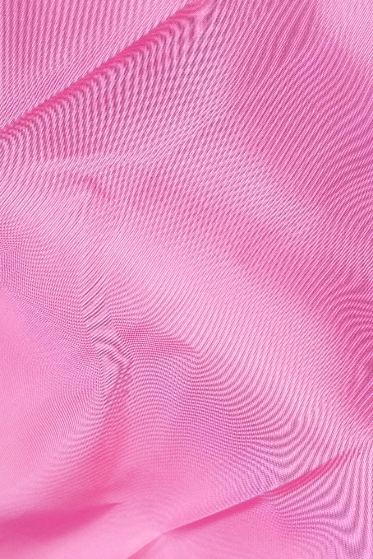 Close up of Pure Silk Rose pink Kanchipuram Saree with Plain Body and Temple Border.  displaying folds