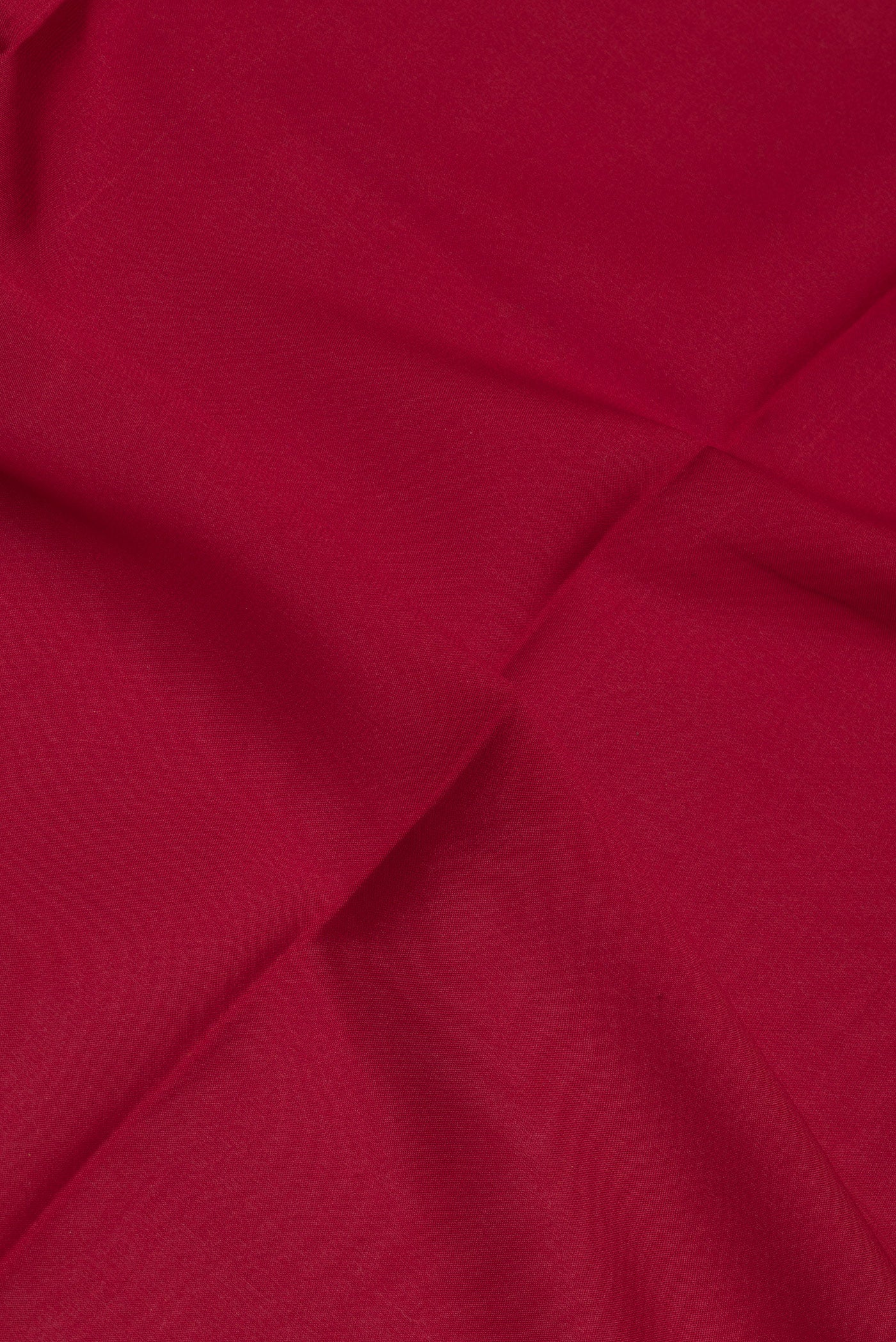 Close up of Maroon Mysore Crepe Saree with Plain Body and Fancy Border.  displaying folds