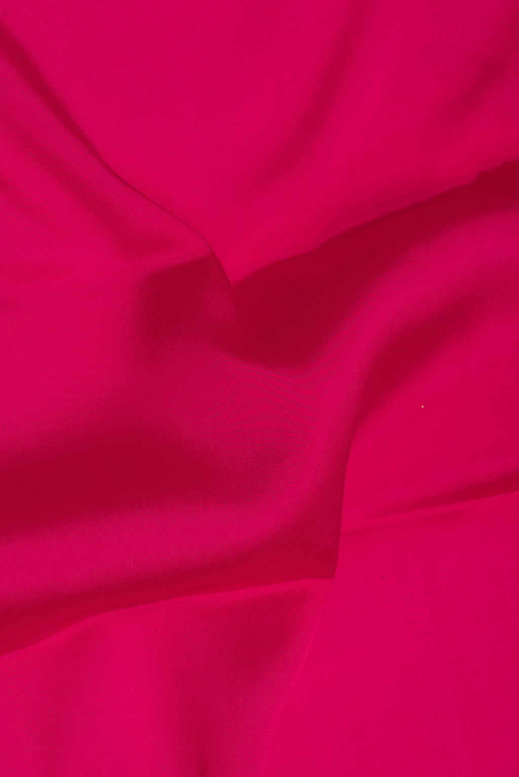 Close up of Pure Silk Dark Pink Mysore Silk Saree with Plain Body and Zari Border.  displaying folds