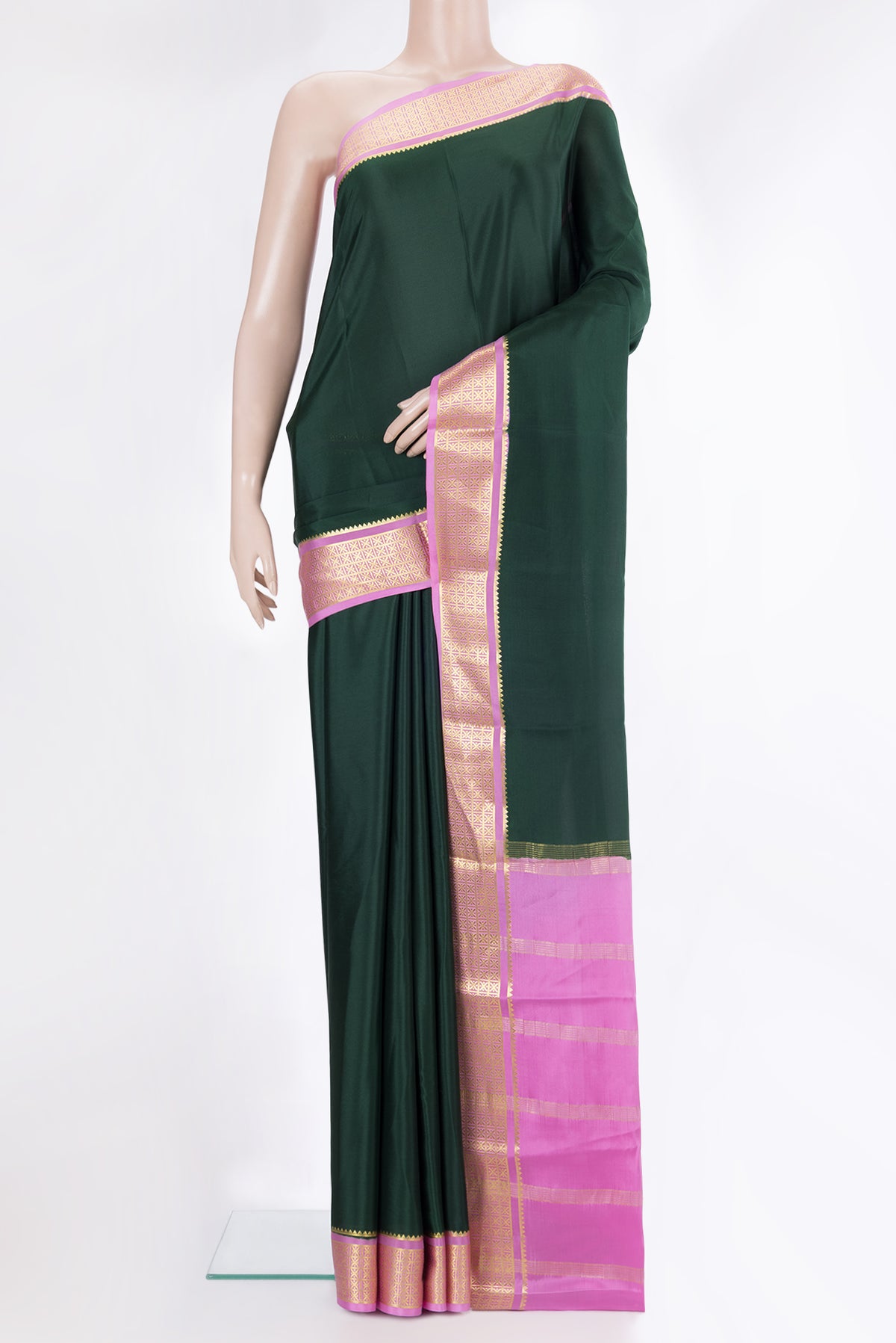 Bottle Green Mysore Crepe Saree with Plain Body and Zari Border.  displayed on a mannequin