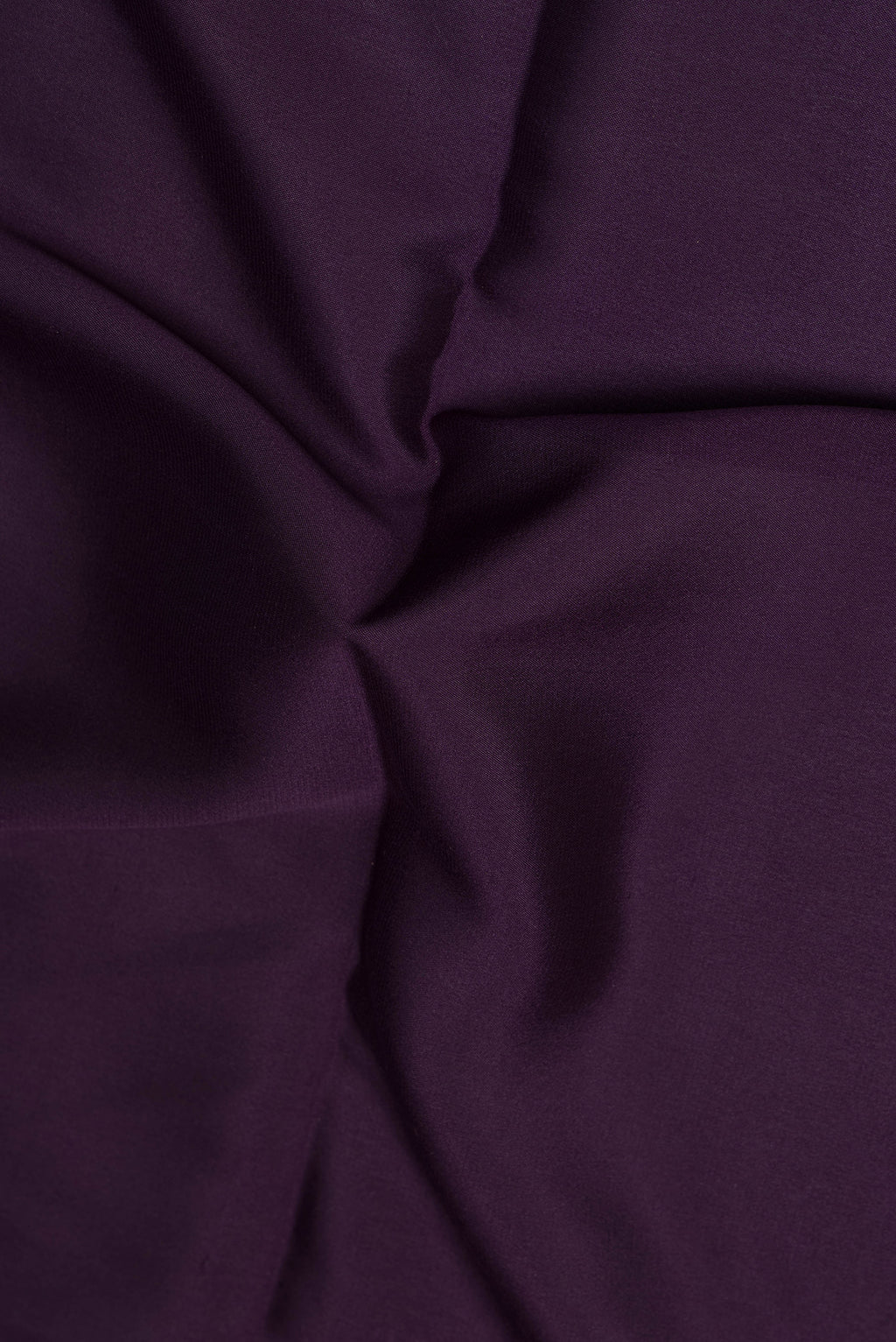 Close up of Purple Mysore Crepe Saree with Plain Body and Zari Border.  displaying folds