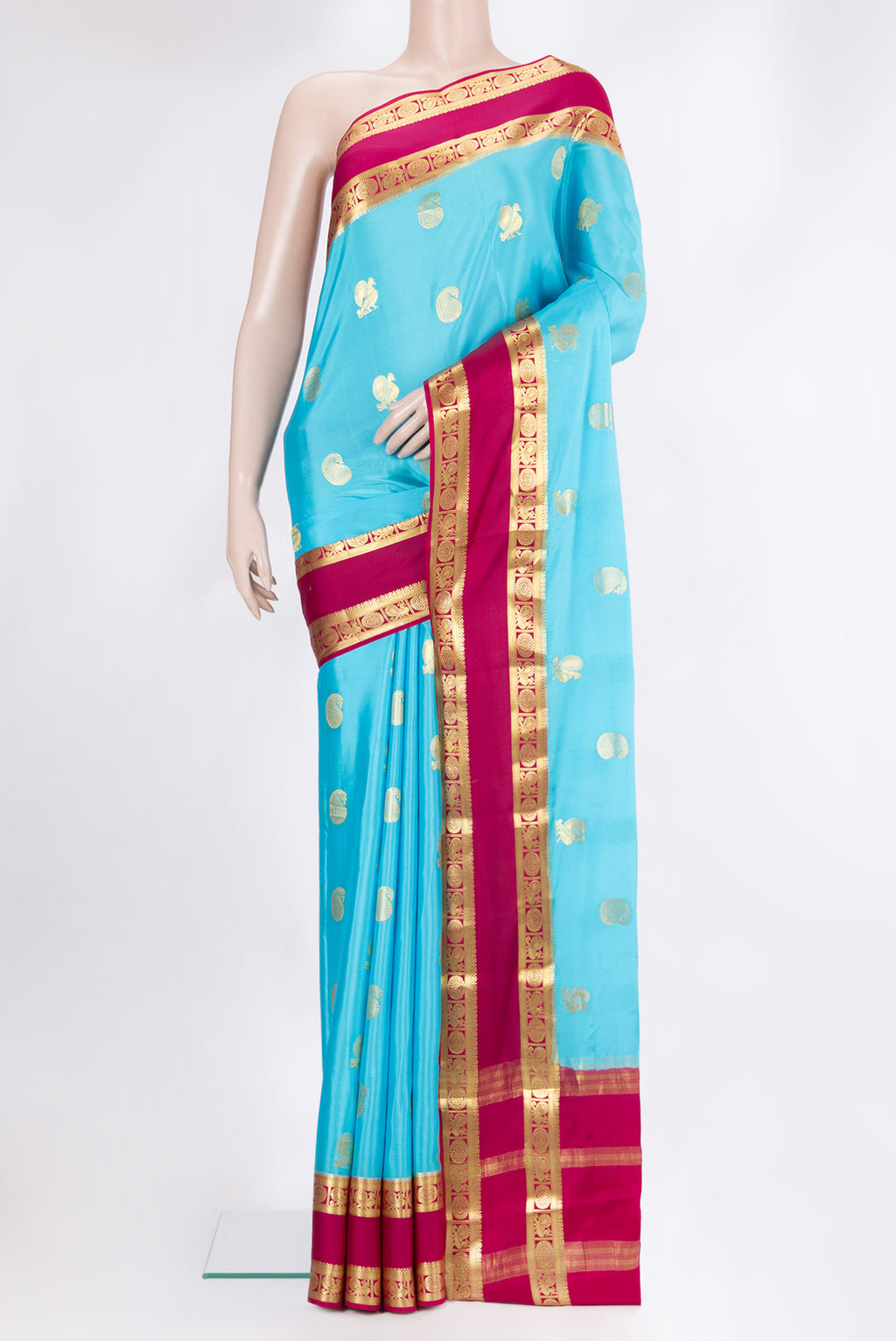 Sky Blue Mysore Chiffon Saree with Zari Butta on the body and Fancy Border.  displayed on a mannequin