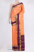 Golden Peach Mysore Crepe Saree with Zari Butta on the body and Fancy Border.  displayed on a mannequin