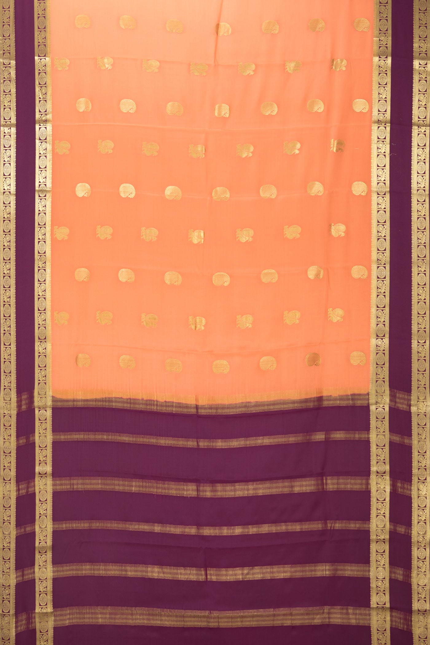 Flat view of Golden Peach Mysore Crepe Saree with Zari Butta on the body and Fancy Border. 