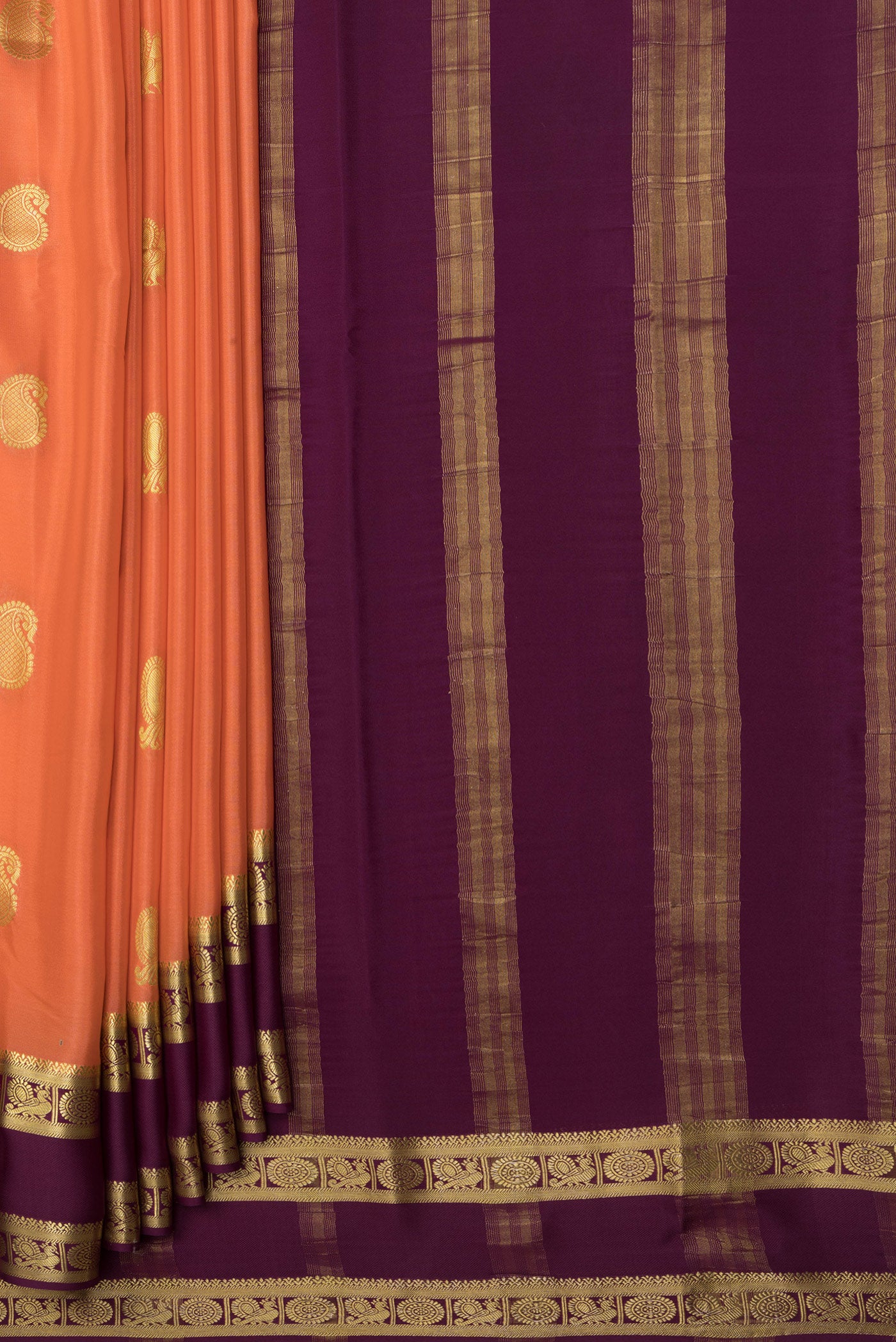 Pleats and pallu of Golden Peach Mysore Crepe Saree with Zari Butta on the body and Fancy Border. 