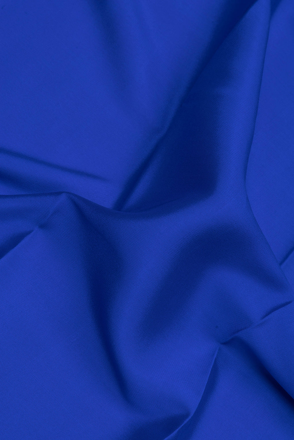 Close up of Royal Blue Mysore Crepe Saree with Plain Body and Fancy Border.  displaying folds