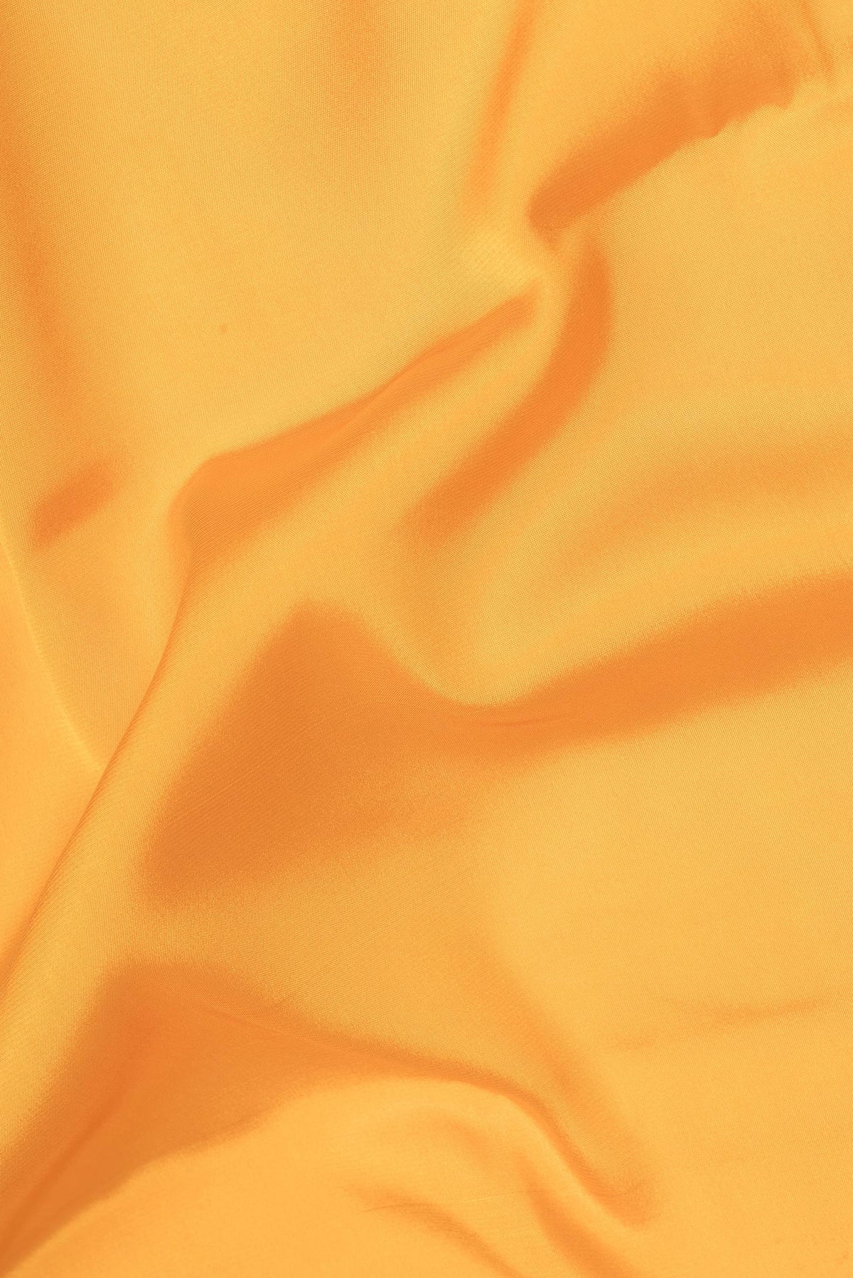 Close up of Pure Silk Yellow Mysore Silk Saree with Plain Body and Zari Border.  displaying folds