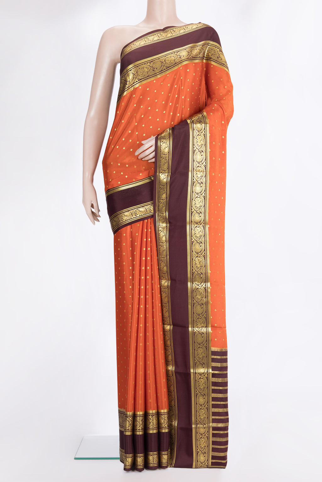Pure Silk Orange Mysore Silk Saree with Zari Butta on the body and Zari Border.  displayed on a mannequin