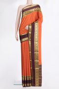 Pure Silk Orange Mysore Silk Saree with Zari Butta on the body and Zari Border.  displayed on a mannequin