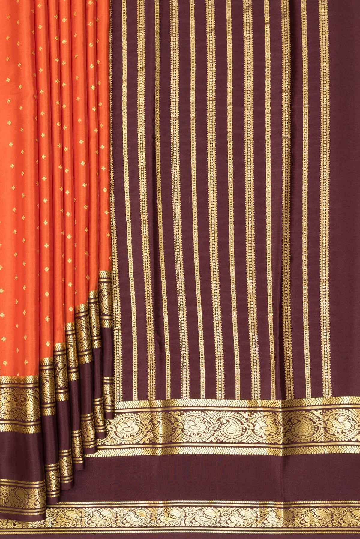 Pleats and pallu of Pure Silk Orange Mysore Silk Saree with Zari Butta on the body and Zari Border. 