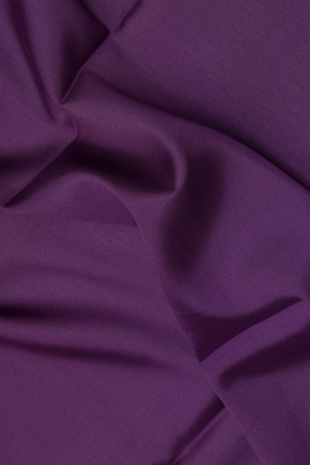 Close up of Purple Mysore Crepe Saree with Plain Body and Zari Border.  displaying folds