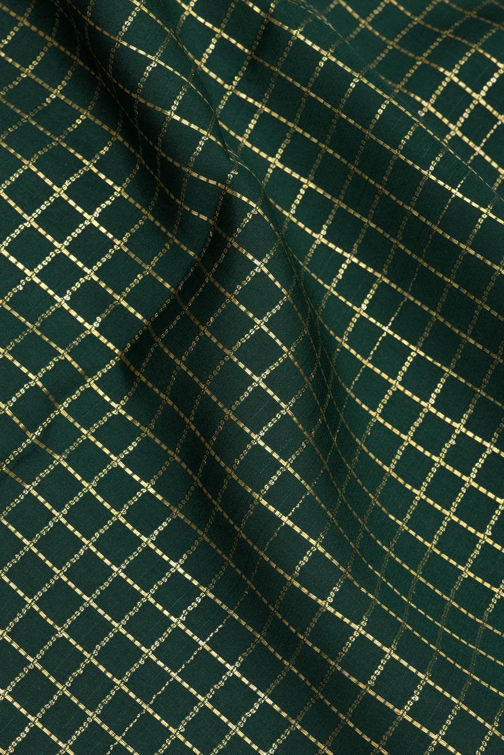 Close up of Bottle Green Mysore Silk Saree with Checked design on the body and Zari Border.  displaying folds