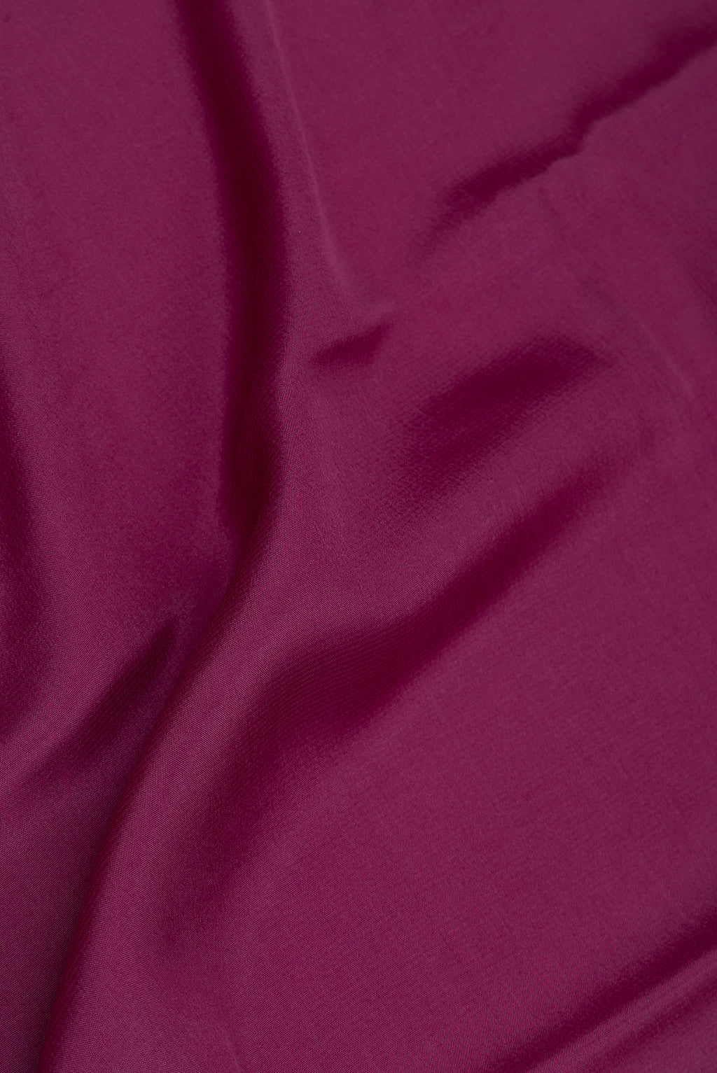Close up of Pure Silk Purple Mysore Silk Saree with Plain Body and Zari Border.  displaying folds