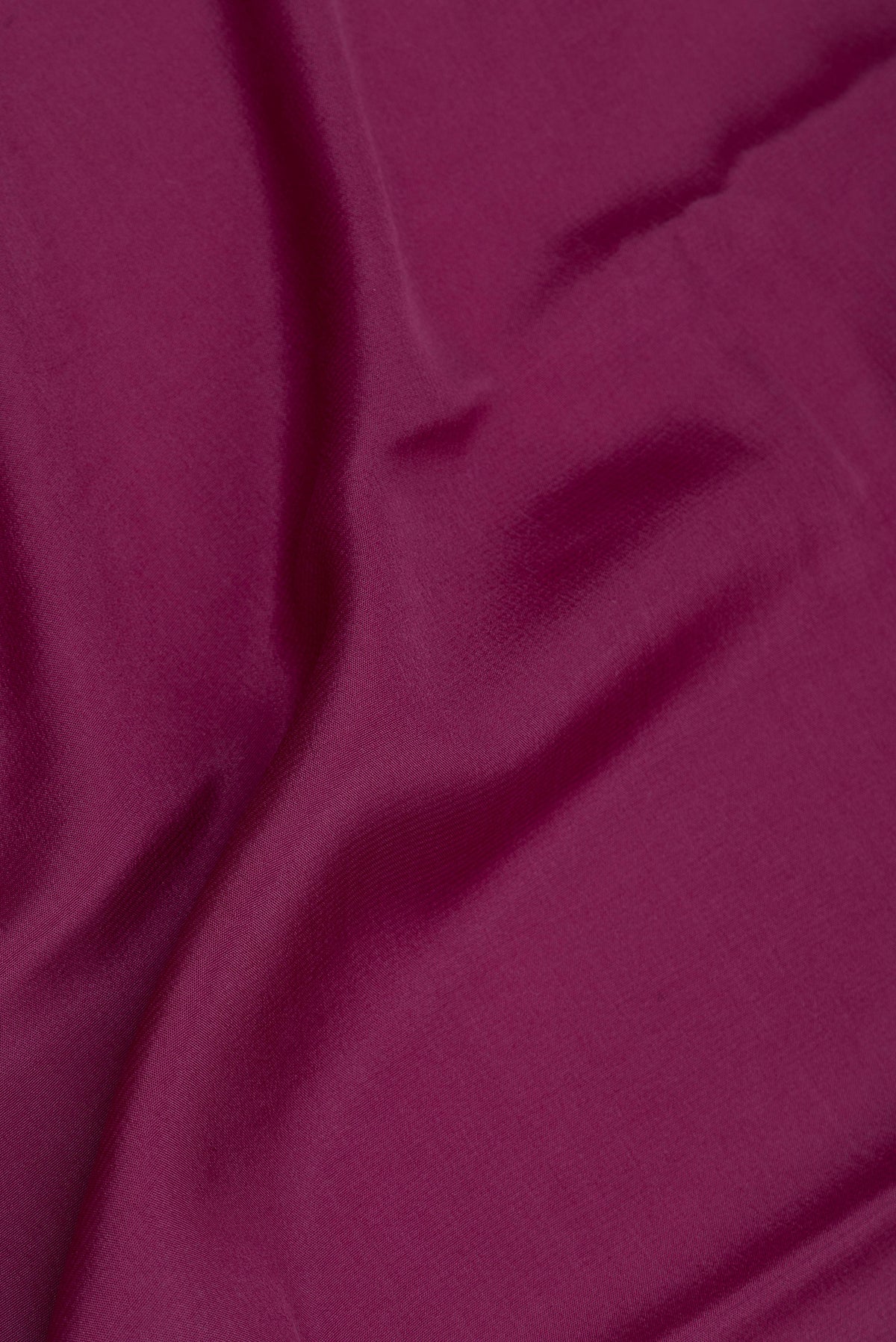 Close up of Pure Silk Purple Mysore Silk Saree with Plain Body and Zari Border.  displaying folds