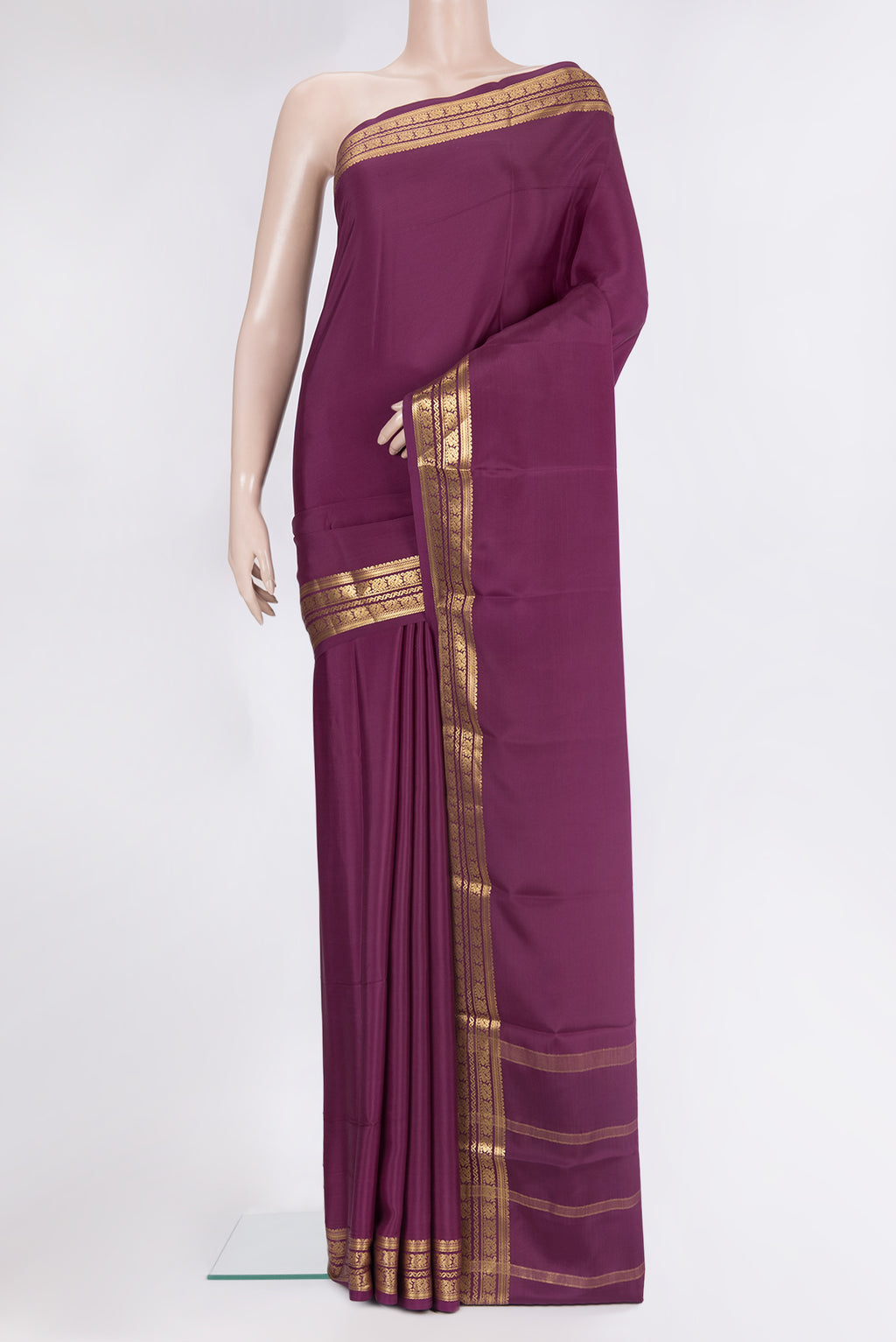 Pure Silk Purple Mysore Silk Saree with Plain Body and Zari Border.  displayed on a mannequin