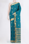 Pure Silk Blue Mysore Silk Saree with Zari Butta on the body and Zari Border.  displayed on a mannequin