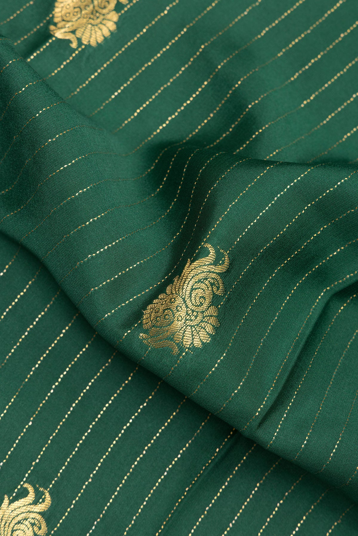 Close up of Bottle Green Mysore Crepe Saree with Stripes on the body and Zari Border.  displaying folds