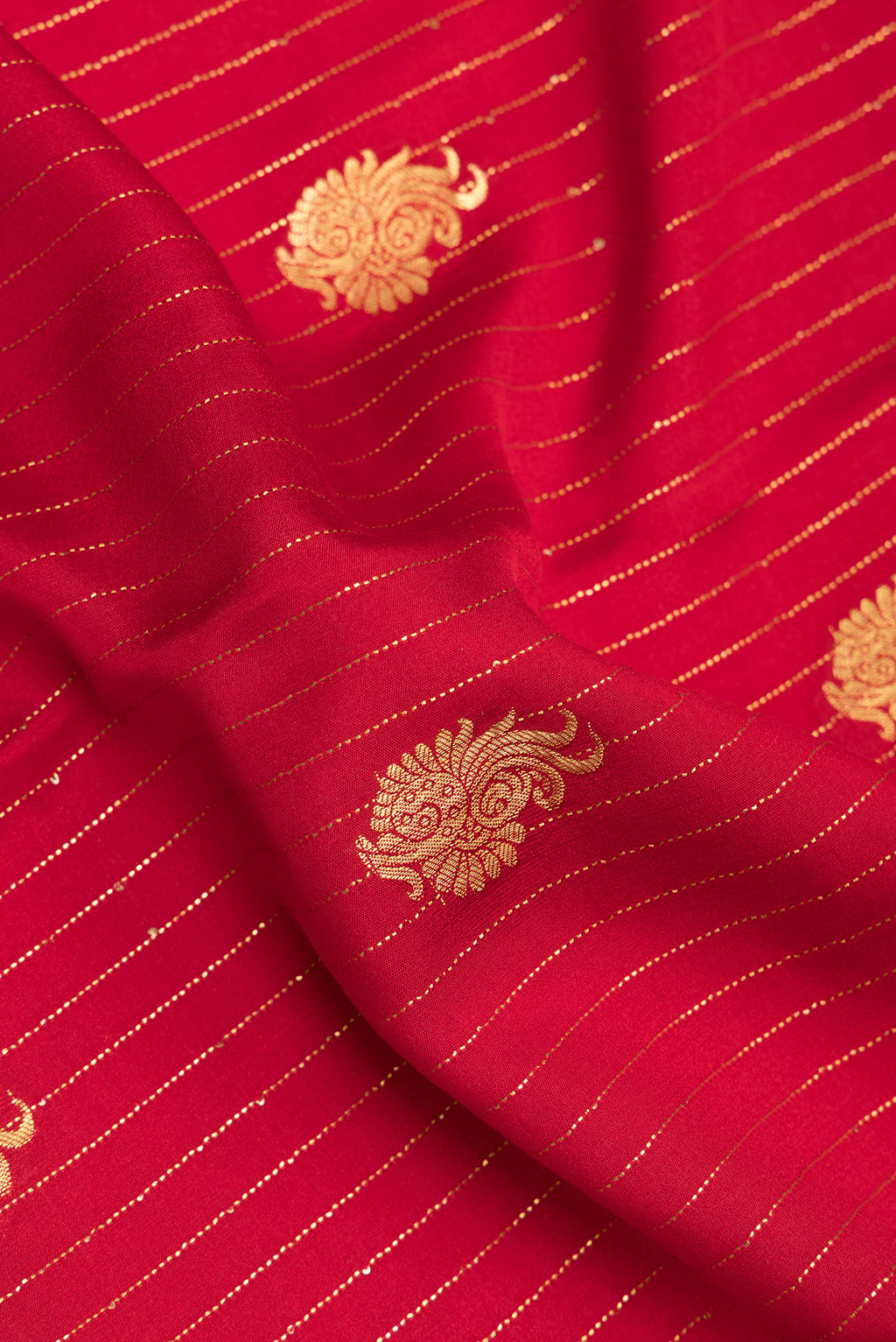 Close up of Red Mysore Crepe Saree with Stripes on the body and Zari Border.  displaying folds