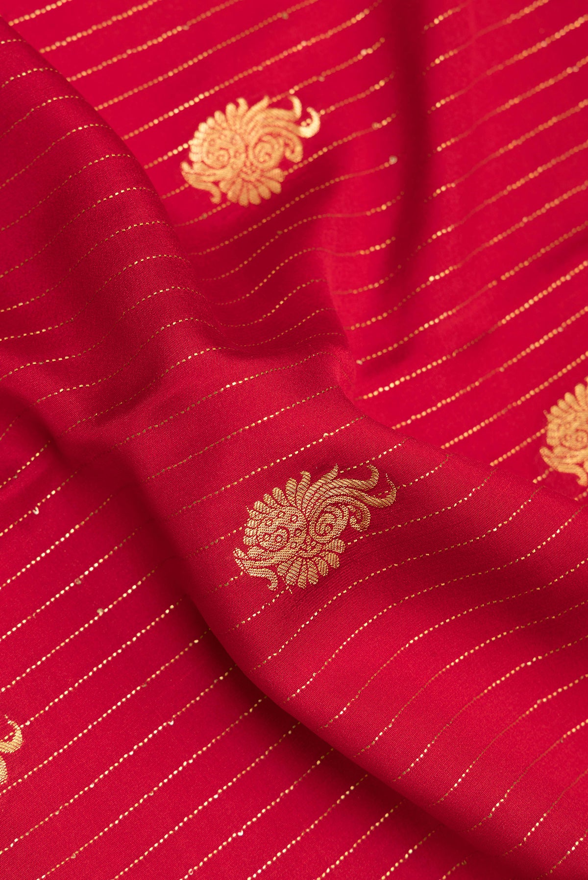 Close up of Red Mysore Crepe Saree with Stripes on the body and Zari Border.  displaying folds