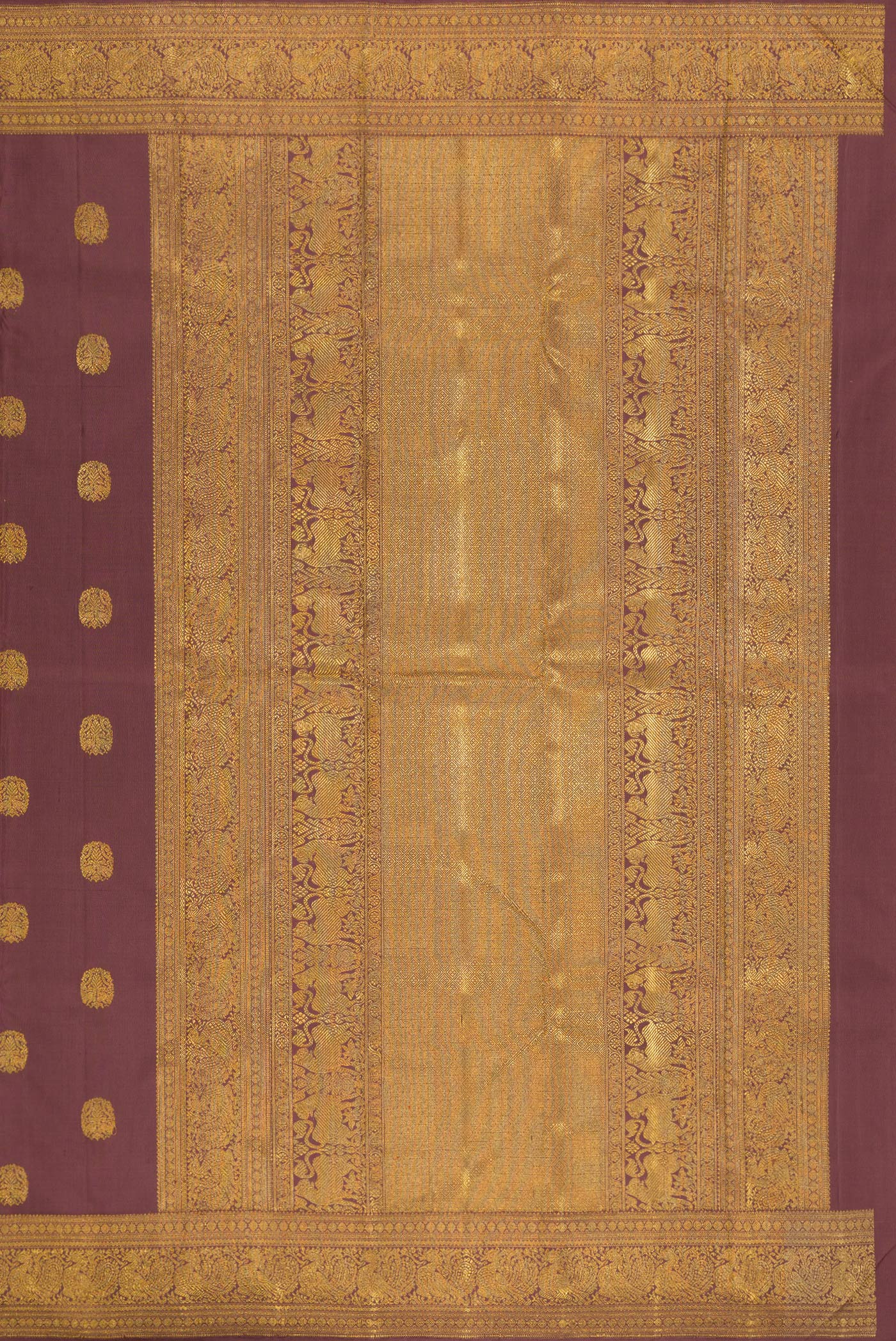 Close up image of the pallu of Pure Silk Pure Zari Brown Kanjivaram Saree with Zari Butta on the body and Zari Border. 