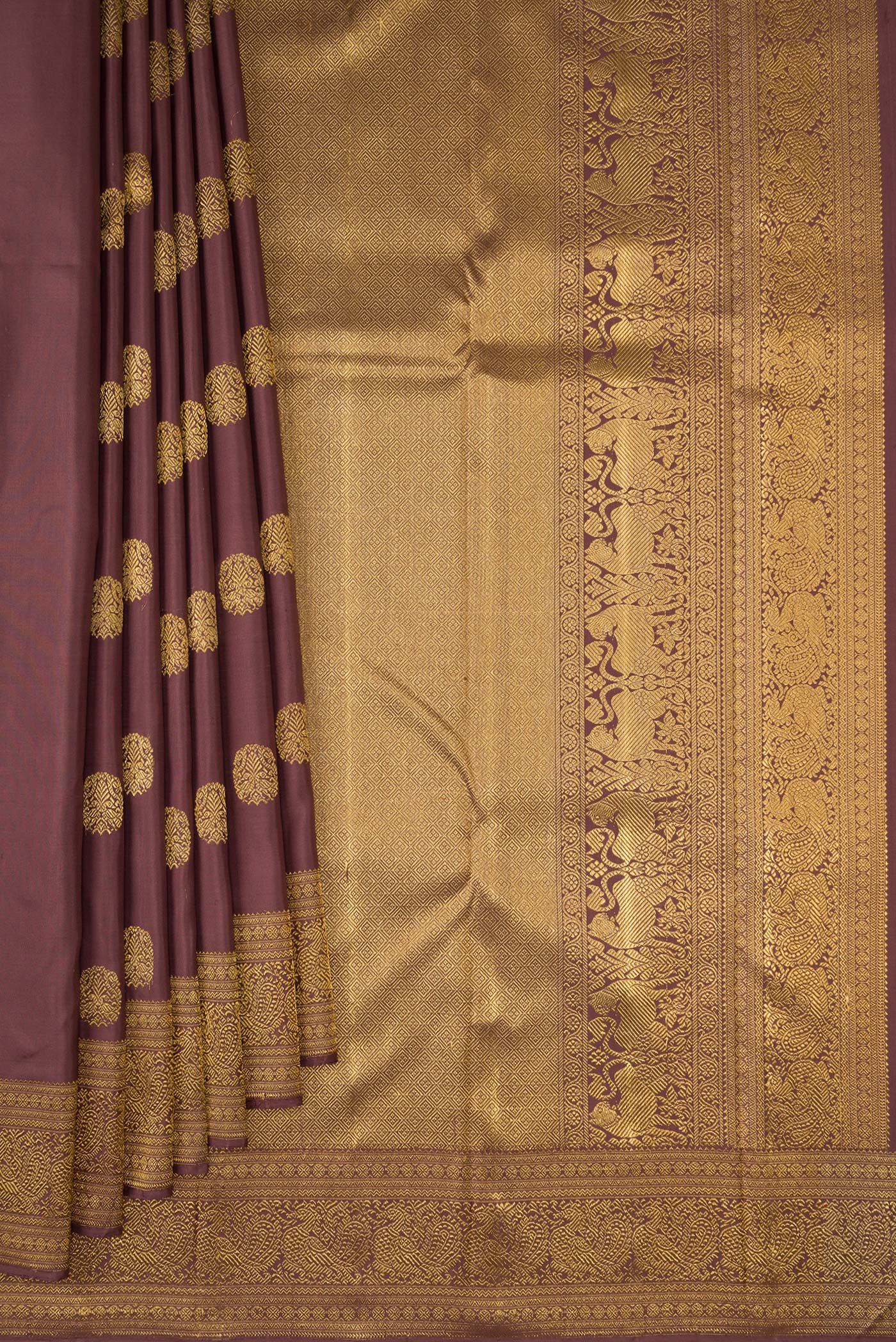 Pleats and pallu of Pure Silk Pure Zari Brown Kanjivaram Saree with Zari Butta on the body and Zari Border. 